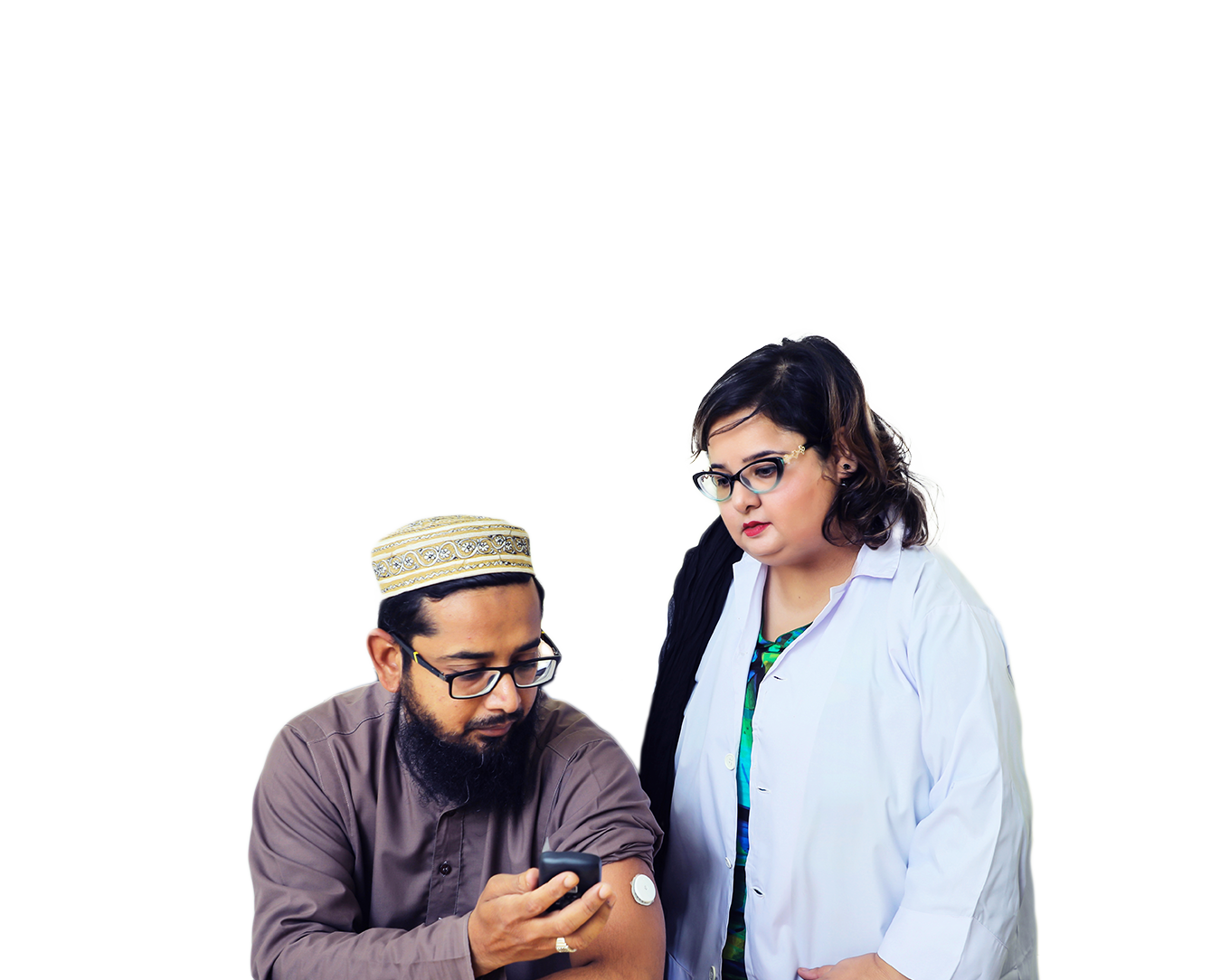 Man checking his blood sugar with woman standing beside him.