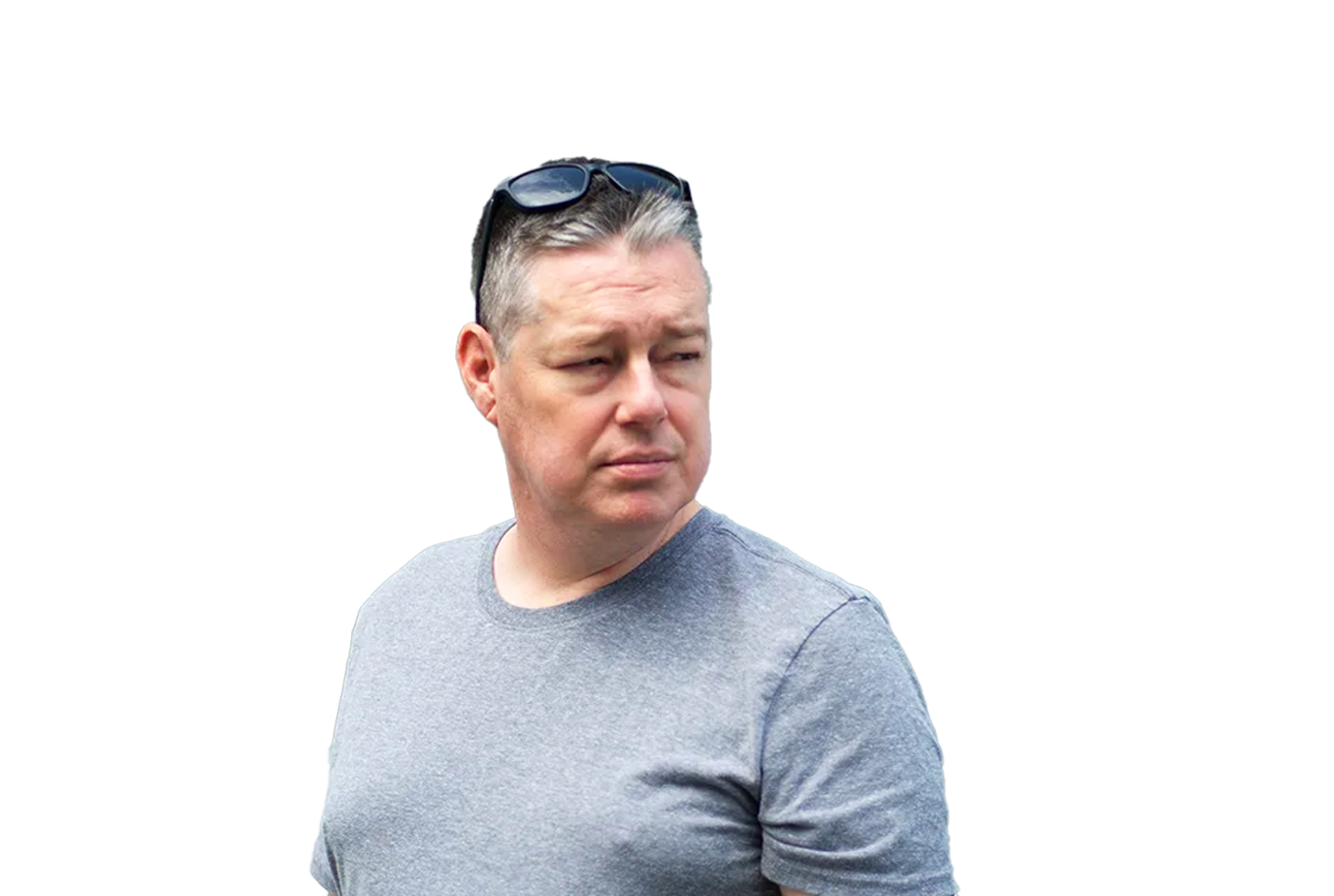 Middle-aged man in grey t-shirt with sunglasses on his head.