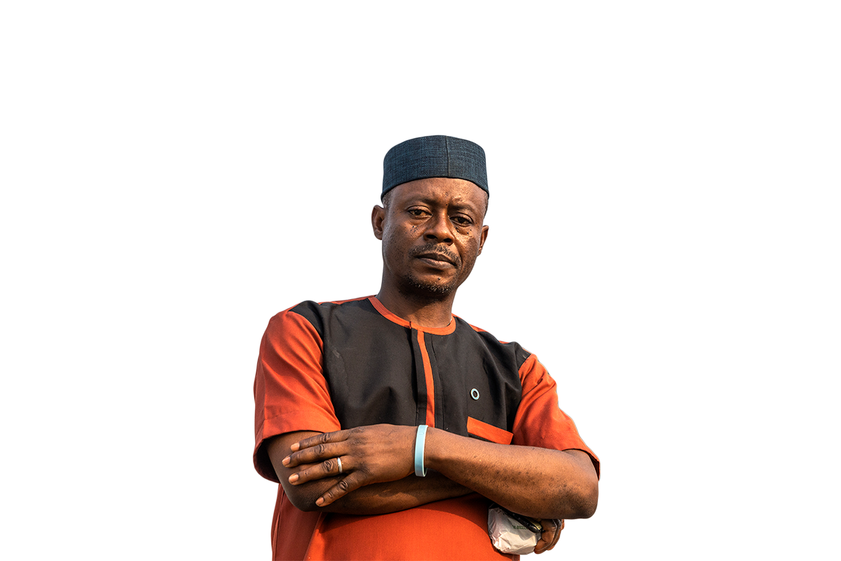 Man standing with a blue circle wristband