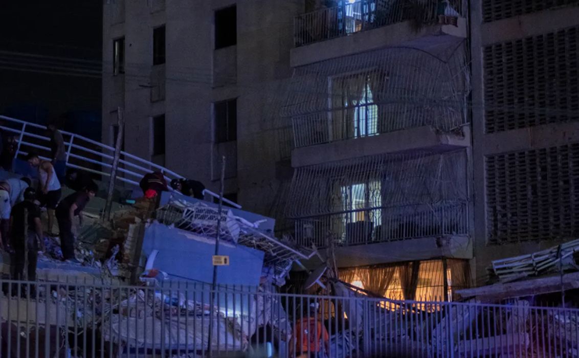 An image of rescue workers going through the rubble follow two back-to-back earthquakes in Venezuela on 24 June.